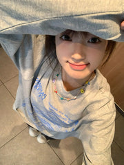 Lunivop Autumn And Winter New Loose Sheet Music Pattern Printed Long Sleeve T-Shirt Top Y2K Millennial Style Top For Women